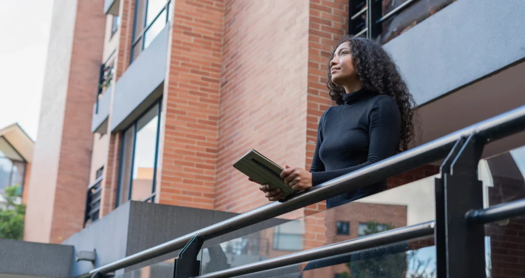 person stood outside assessing a buy to let property