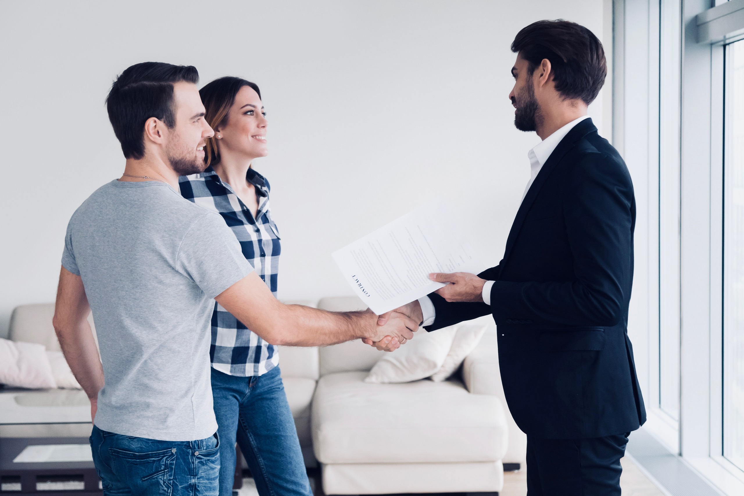 couple-shaking-hands-with-prosperity-wealth-on-agreement-for-buying-off-plan-property-purchase