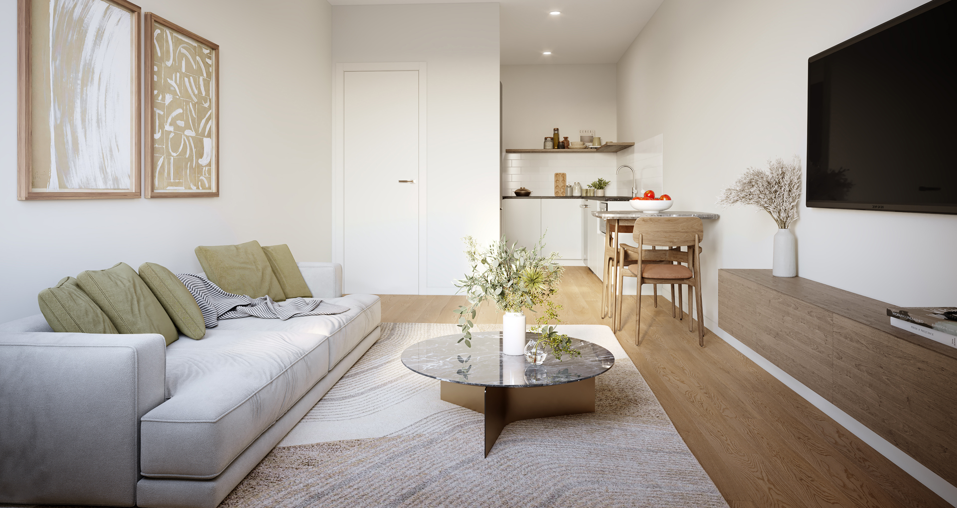 Living room kitchen inside the lakeside apartments. The room is decorated in neutral colours.